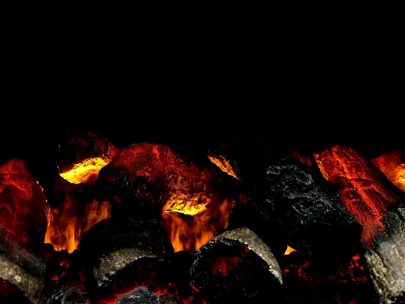 Glowing coals in the Saffra kitchen at the start of service